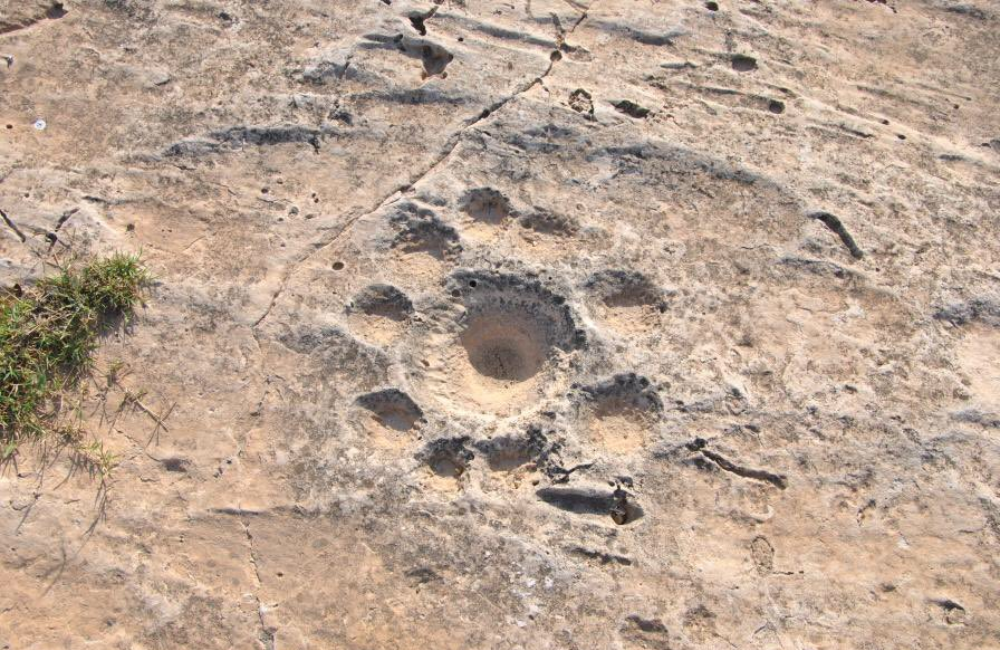 The Discovery of Mysterious Parallel Dents in Qatar